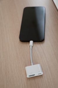 Connect an HDMI adapter to the iPhone
